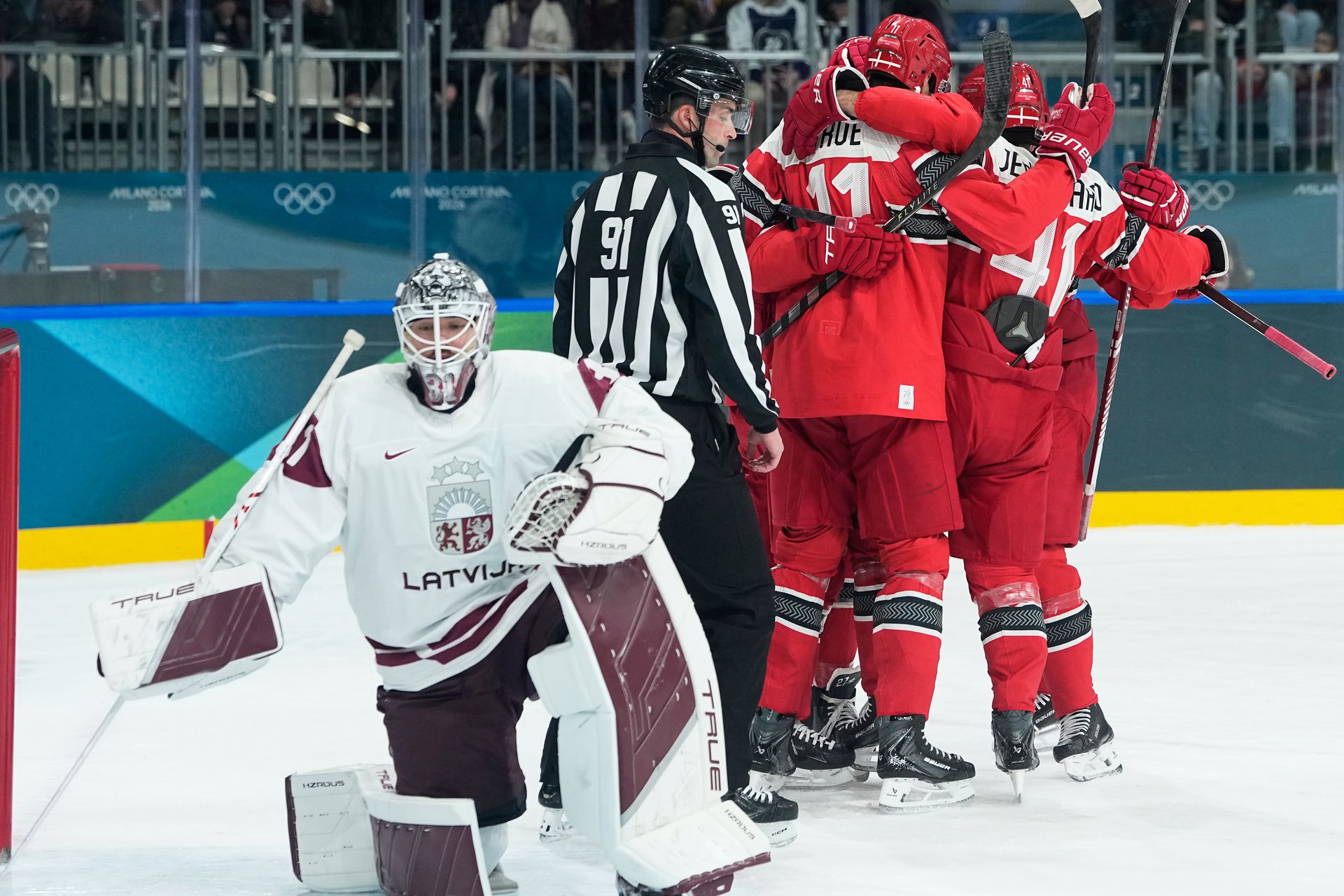 Dánsko - Lotyšsko / ZOH 2026. Zdroj: SITA/AP