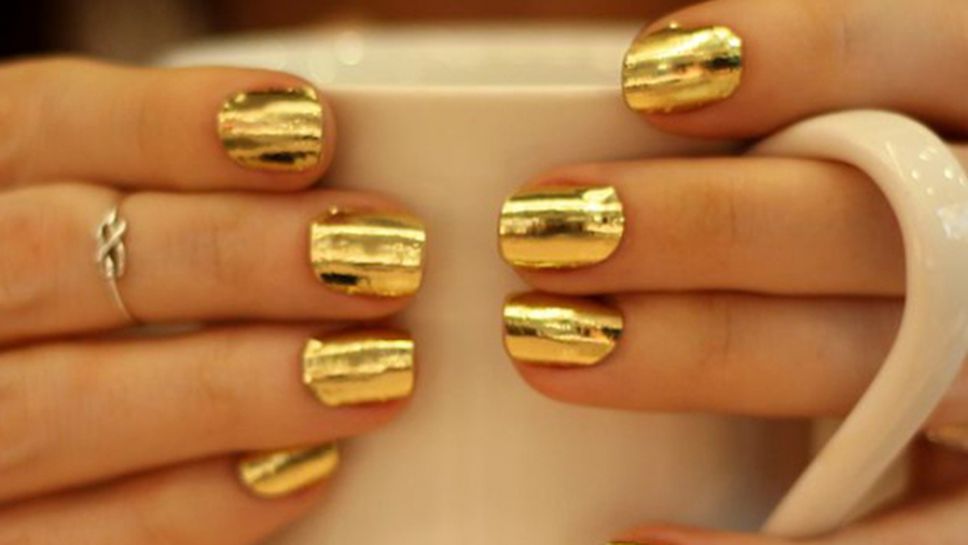 Олимпийската шампионка Каси Шарп обича да лакира ноктите си в златен цвят