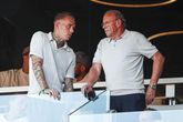 Rick Karsdorp op de tribunes bij PSV, met rechts van hem Mart van den Heuvel, spelersbegeleider van de club © ANP