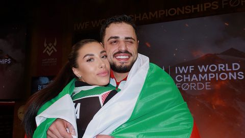 Световният и олимпийски шампион по вдигане на тежести и приятелката